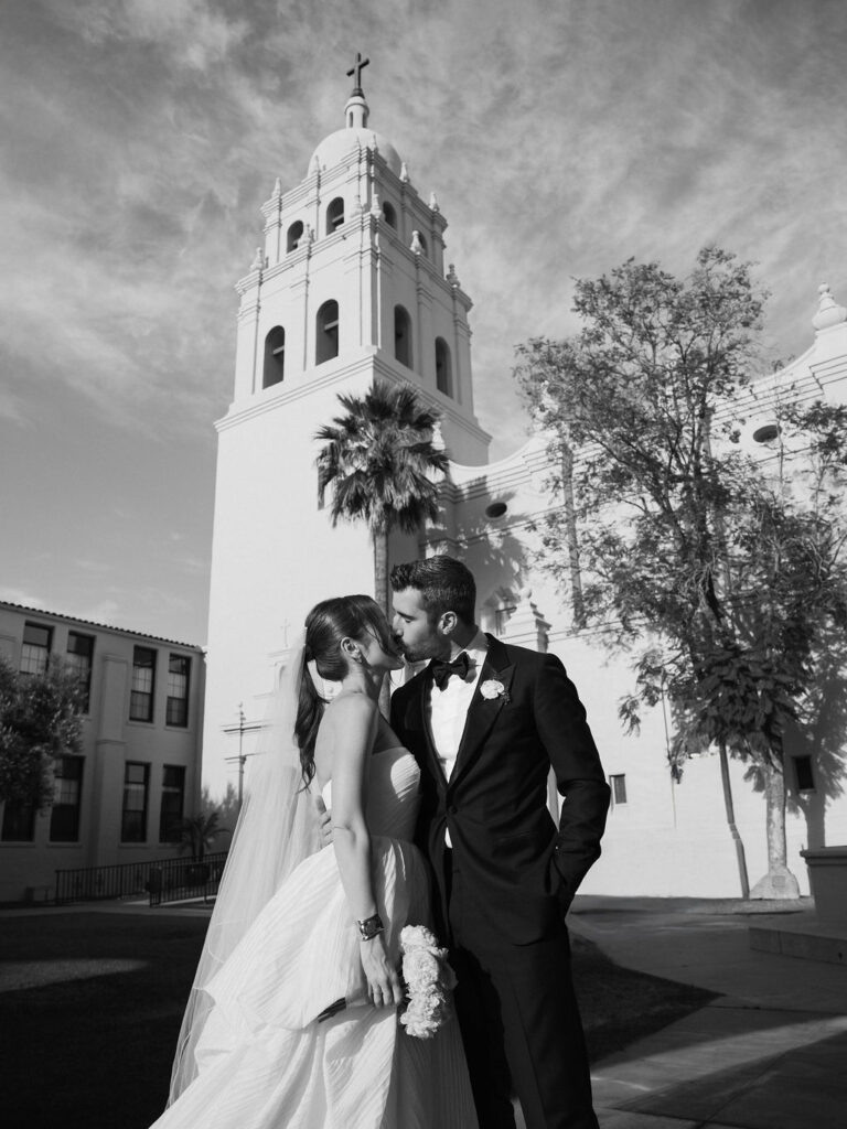 Bride and groom outside Brophy Chapel Arizona black and white