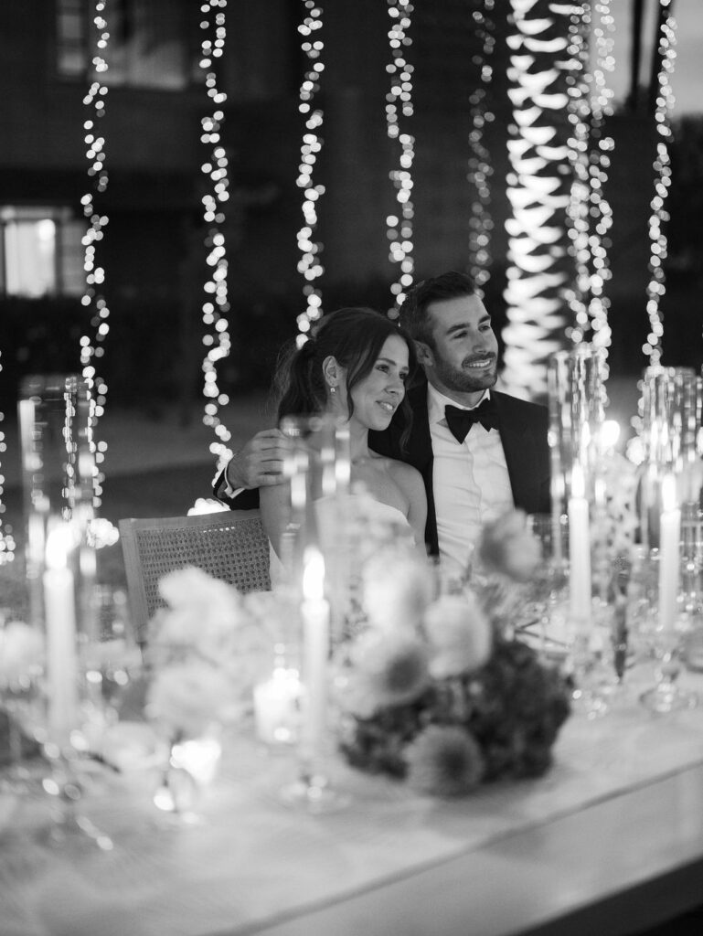 Bride and groom sweetheart table romantic candlelight