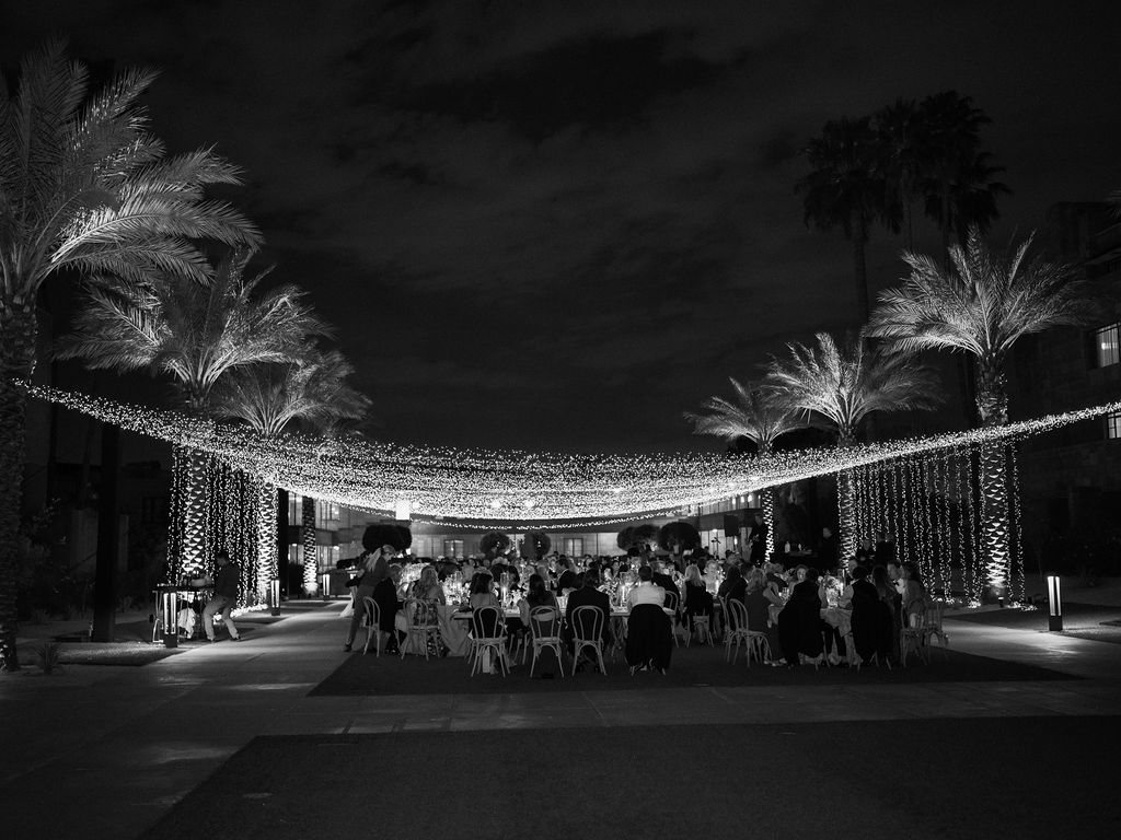 Black and white wedding reception under string lights Arizona
