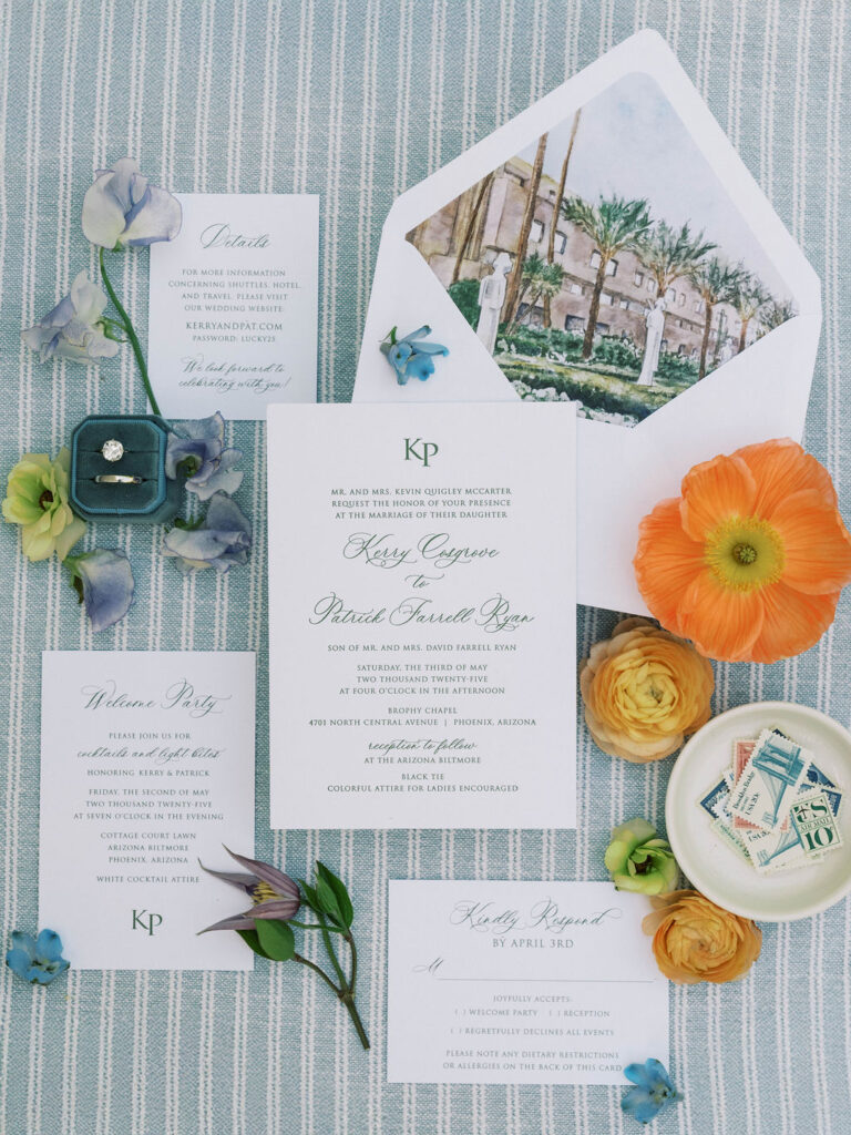 Fine art wedding invitation suite flat lay with florals