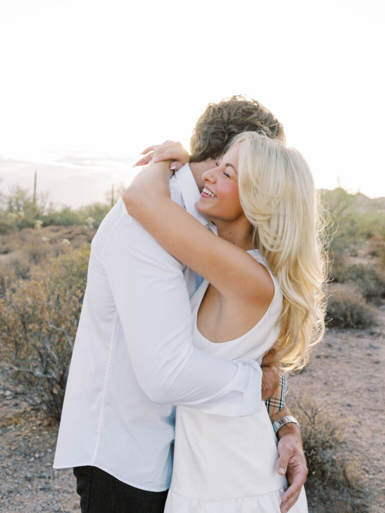 Arizona desert engagement photography candid kiss