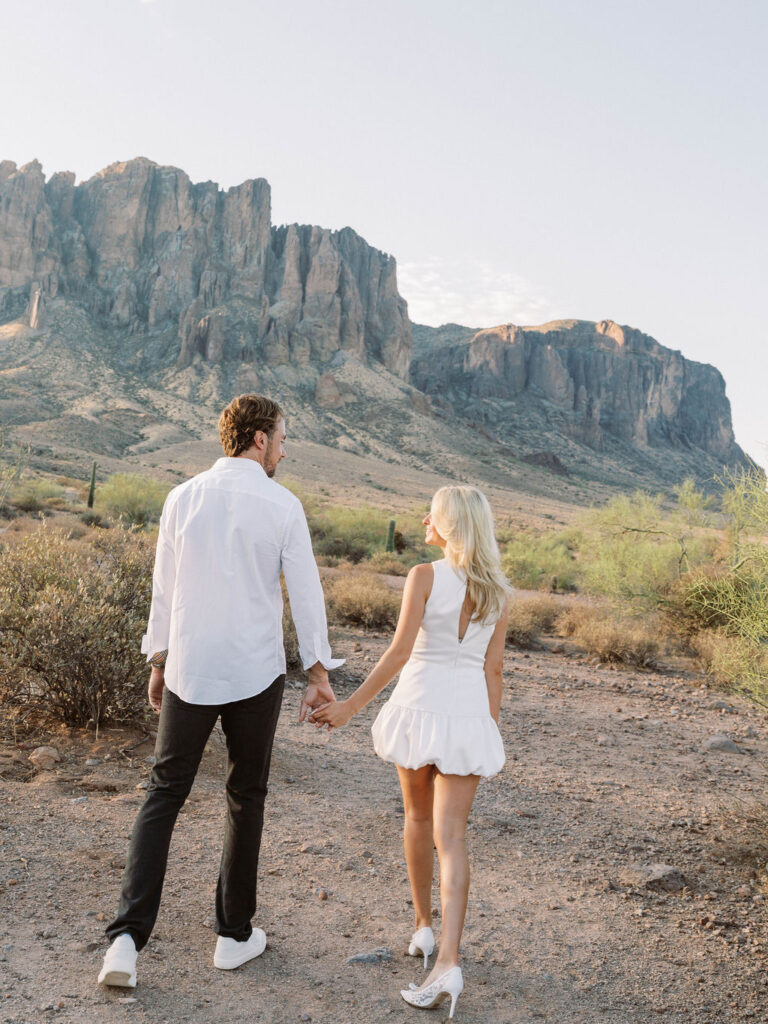 Arizona desert engagement photos walking couple