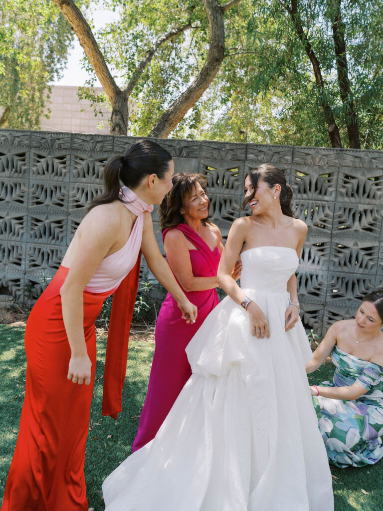 Bride with bridesmaids candid moment Arizona wedding