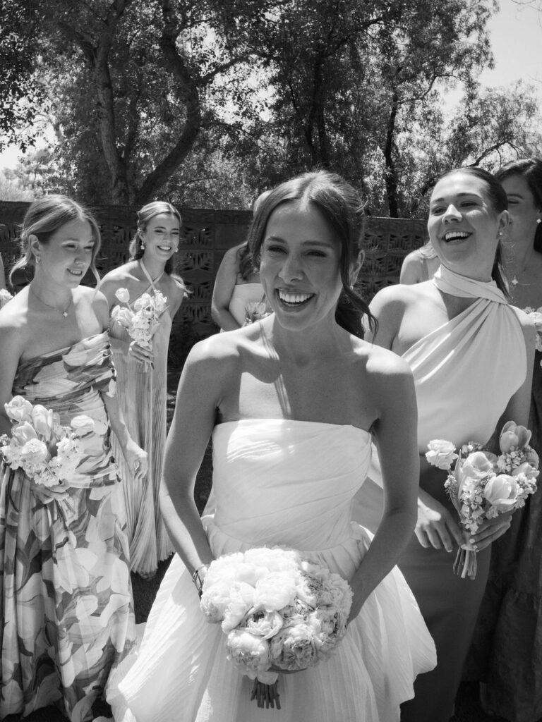 Black and white candid of bride and bridesmaids Arizona wedding