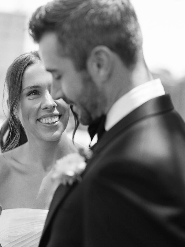 Romantic black and white wedding photo bride and groom smiling