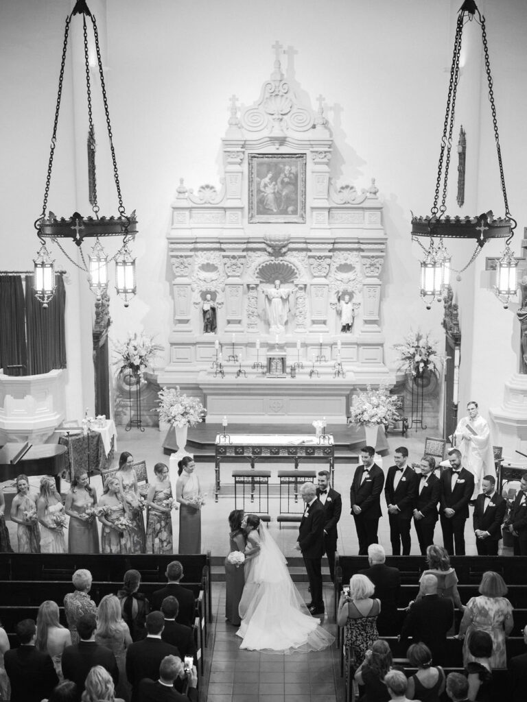 Bride and groom at wedding ceremony inside Brophy Chapel in Phoenix