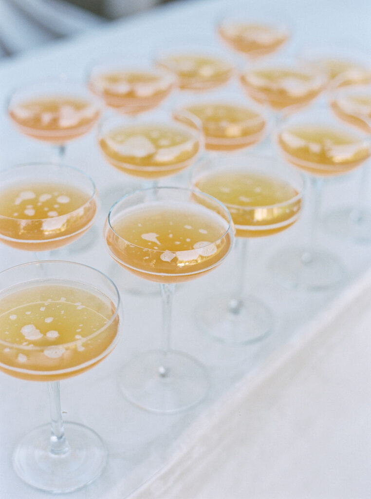 Champagne glasses lined up for wedding reception toast.