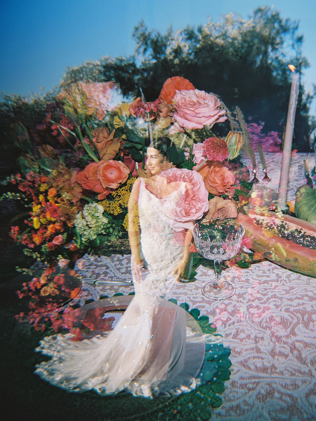 Artistic bridal portrait surrounded by colorful florals at El Chorro.