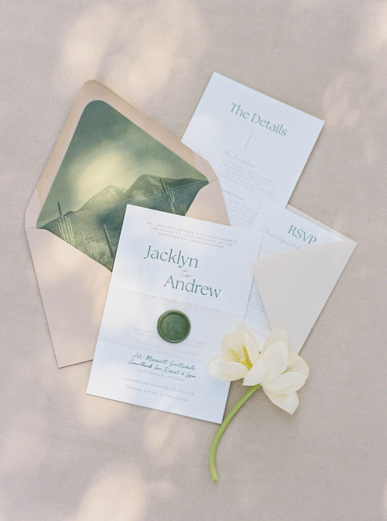 Wedding invitation suite styled flatlay at Camelback Inn
