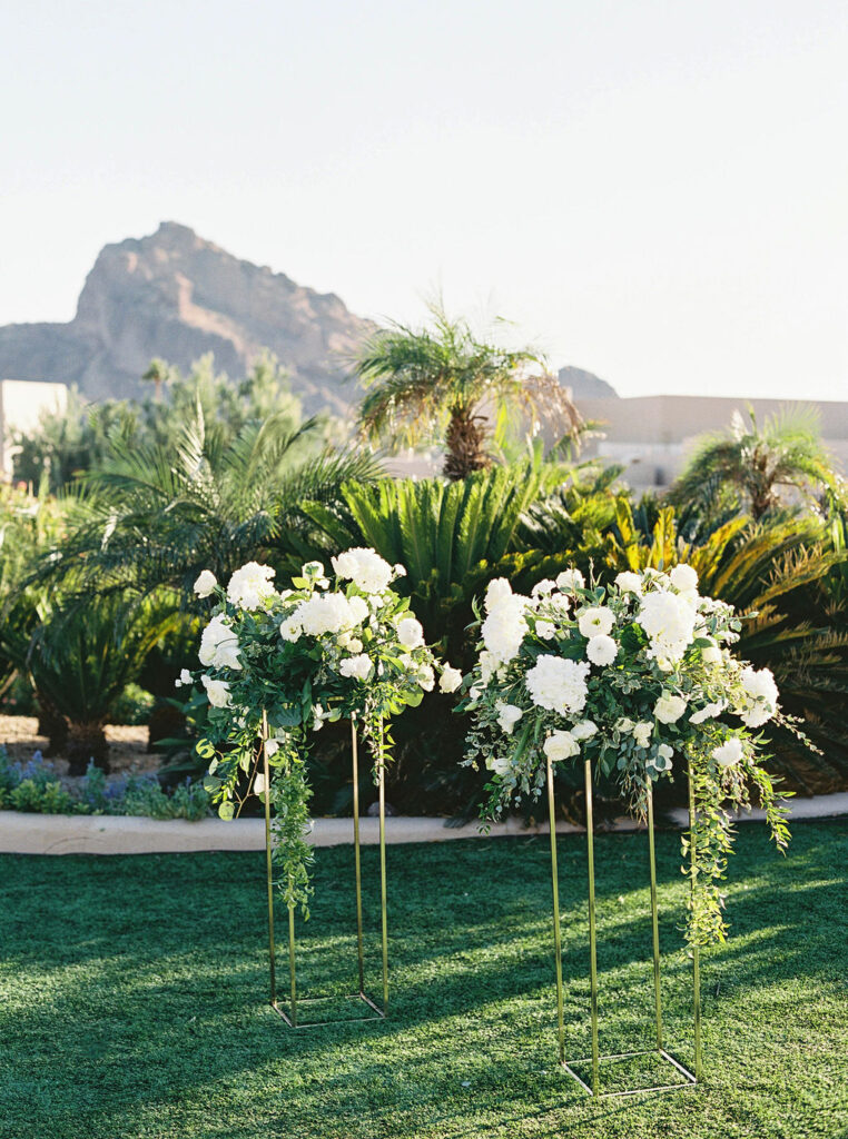 Luxury Camelback Inn wedding ceremony with floral arch and mountain views