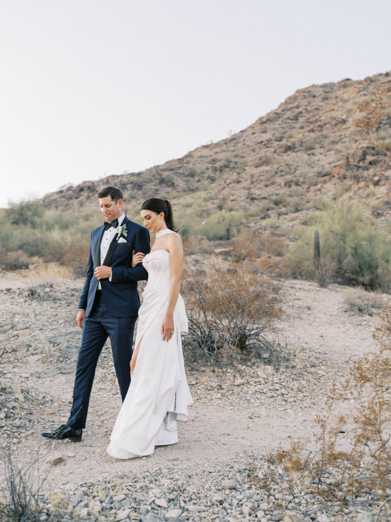 Bride and groom walking together at Camelback Inn desert wedding