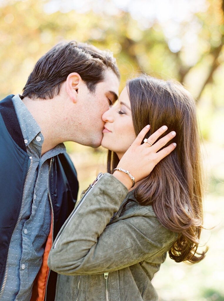 Romantic fall engagement kiss in Central Park New York
