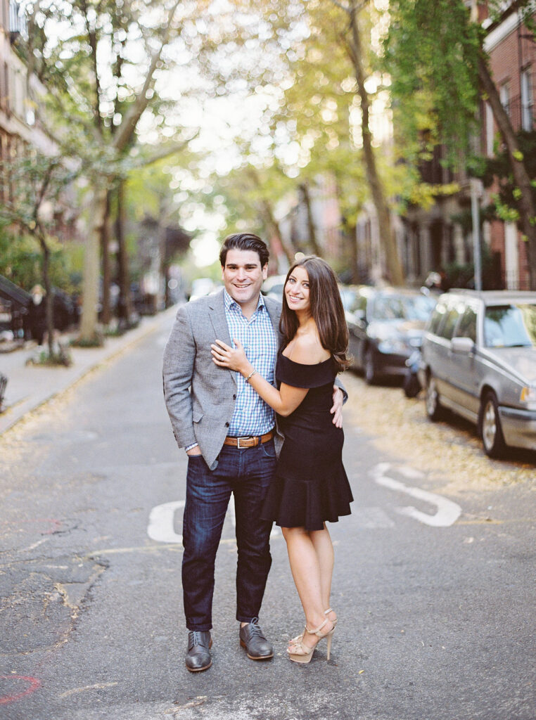 Romantic NYC fall engagement photo on tree-lined West Village street