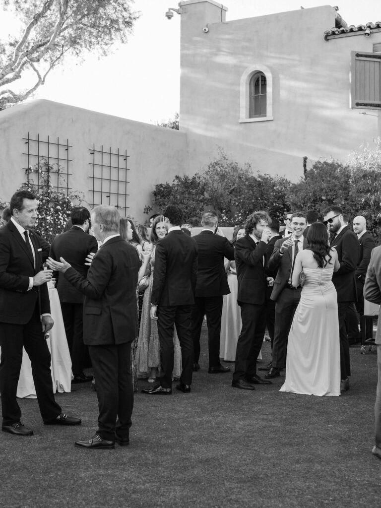 Wedding guests mingling at outdoor cocktail hour DC Ranch