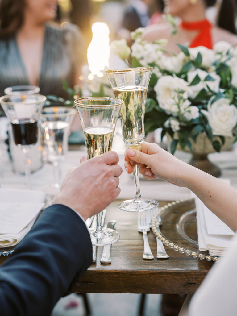 Champagne toast detail during DC Ranch wedding reception