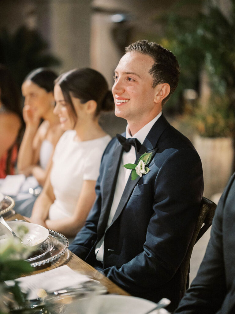 Groom smiling during wedding reception at DC Ranch