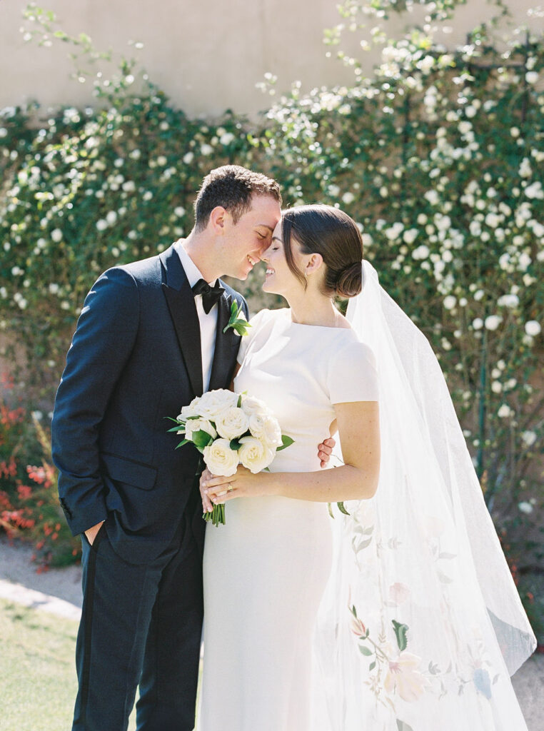 Bride and groom kiss during DC Ranch Arizona wedding