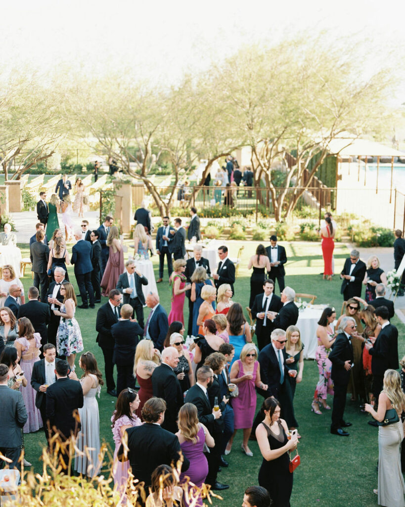 Wedding guests mingling during cocktail hour at DC Ranch