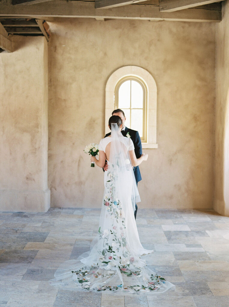 Bride and groom walking hand in hand at DC Ranch Arizona