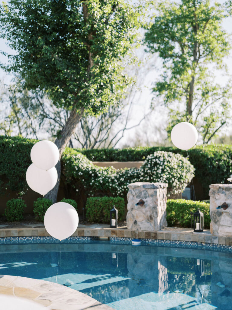Balloons by the pool at Silverleaf Masters Golf Arizona wedding welcome party