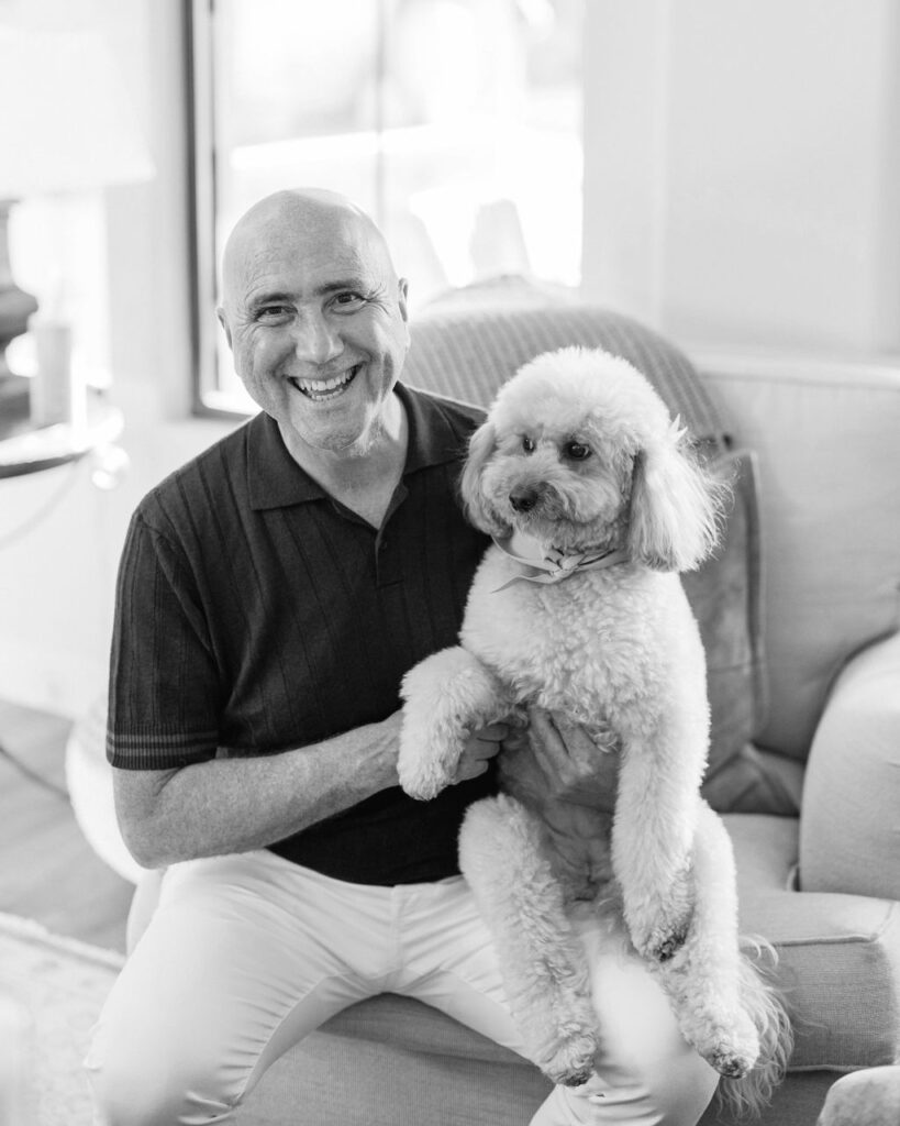 Guest holding dog during Silverleaf Masters Golf Arizona wedding welcome party
