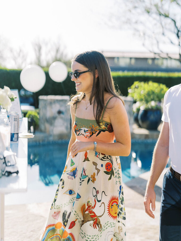 Guest in colorful patterned dress at Silverleaf Arizona wedding welcome party