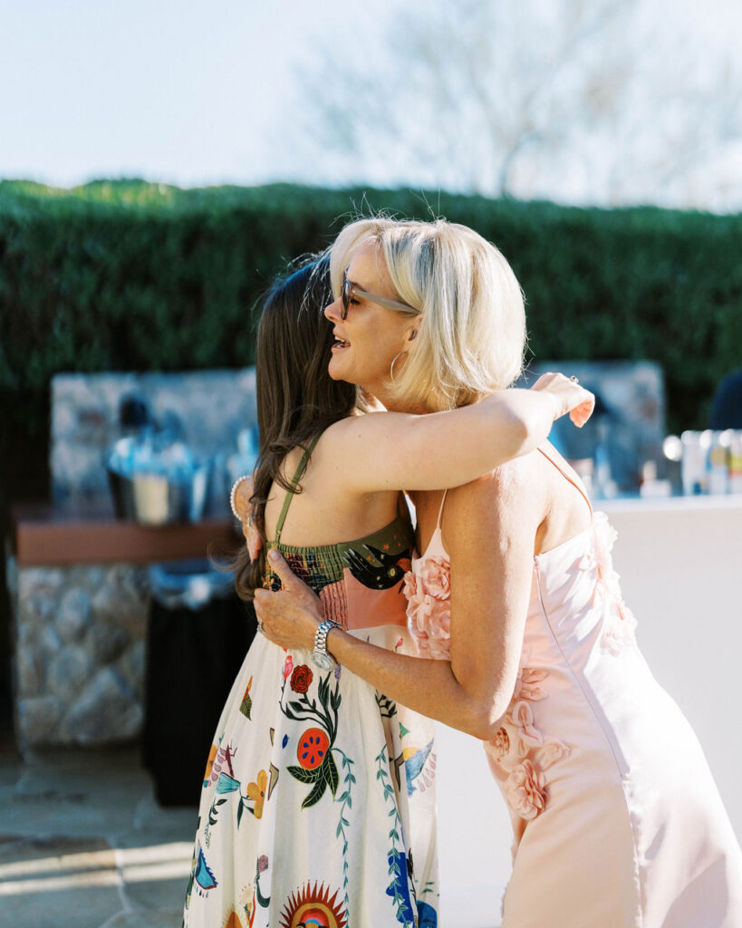 Guests embrace during Silverleaf Masters Golf Arizona wedding welcome party