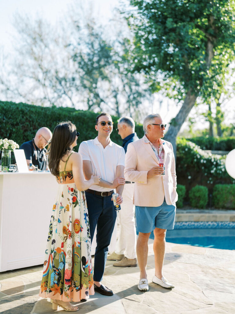 Guests walking poolside during Silverleaf Masters Golf wedding welcome party