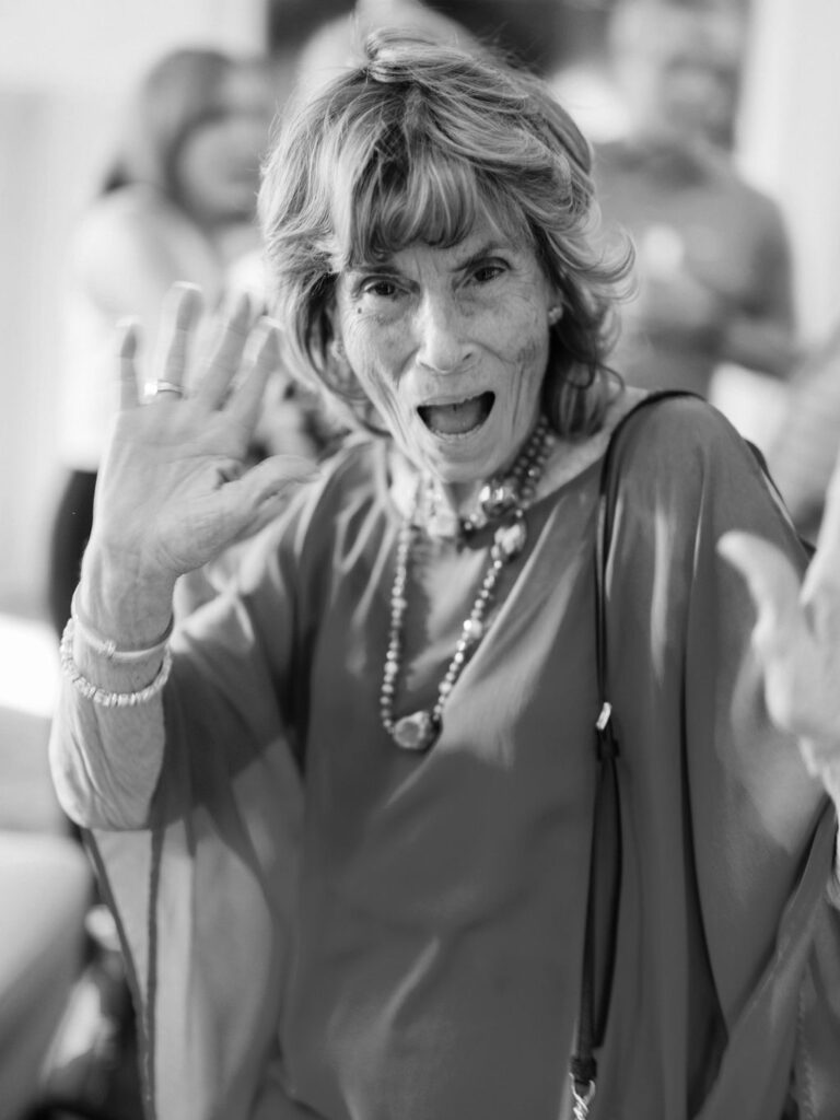 Guest waving during Silverleaf Masters Golf Arizona wedding welcome party