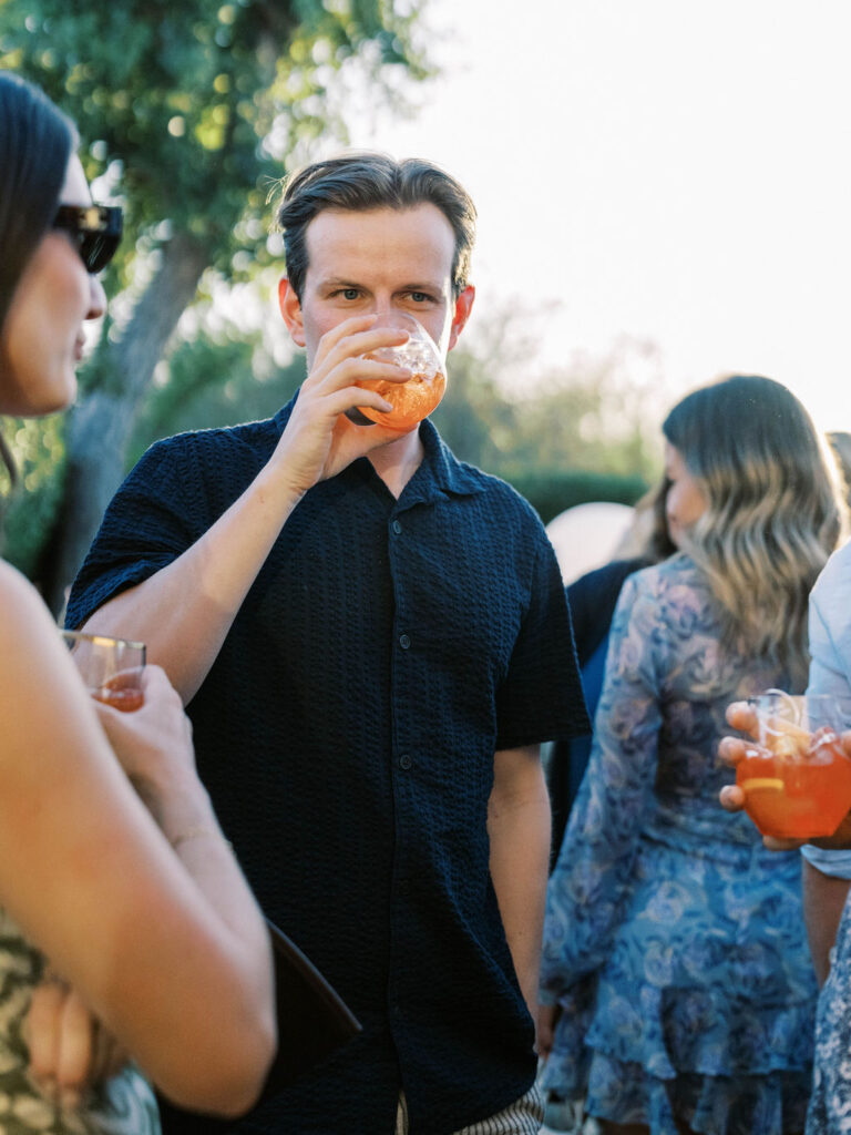 Guest sipping cocktail at Silverleaf Arizona Masters Golf welcome party