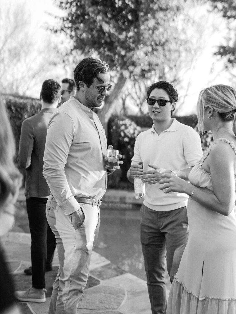 Guests talking at Silverleaf Masters Golf Arizona wedding welcome party