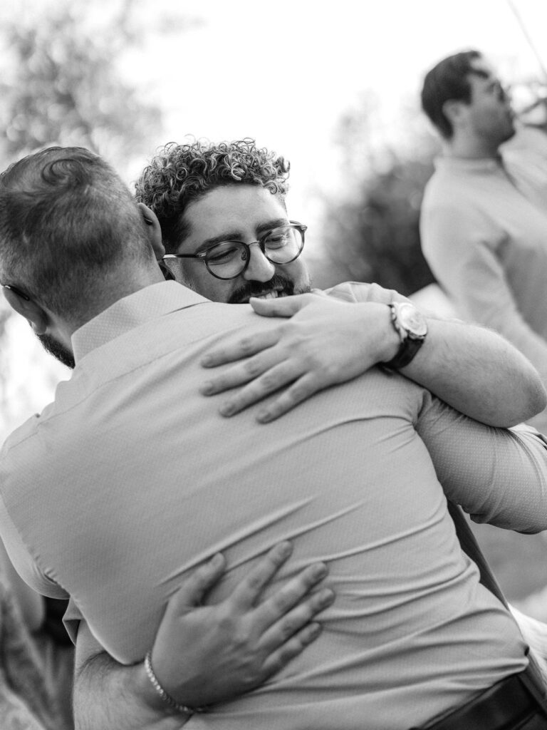Guests hugging at Silverleaf Arizona Masters Golf wedding welcome party