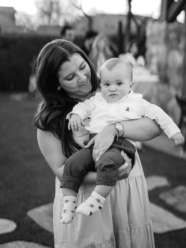 Guest holding baby at Silverleaf Masters Golf wedding welcome party