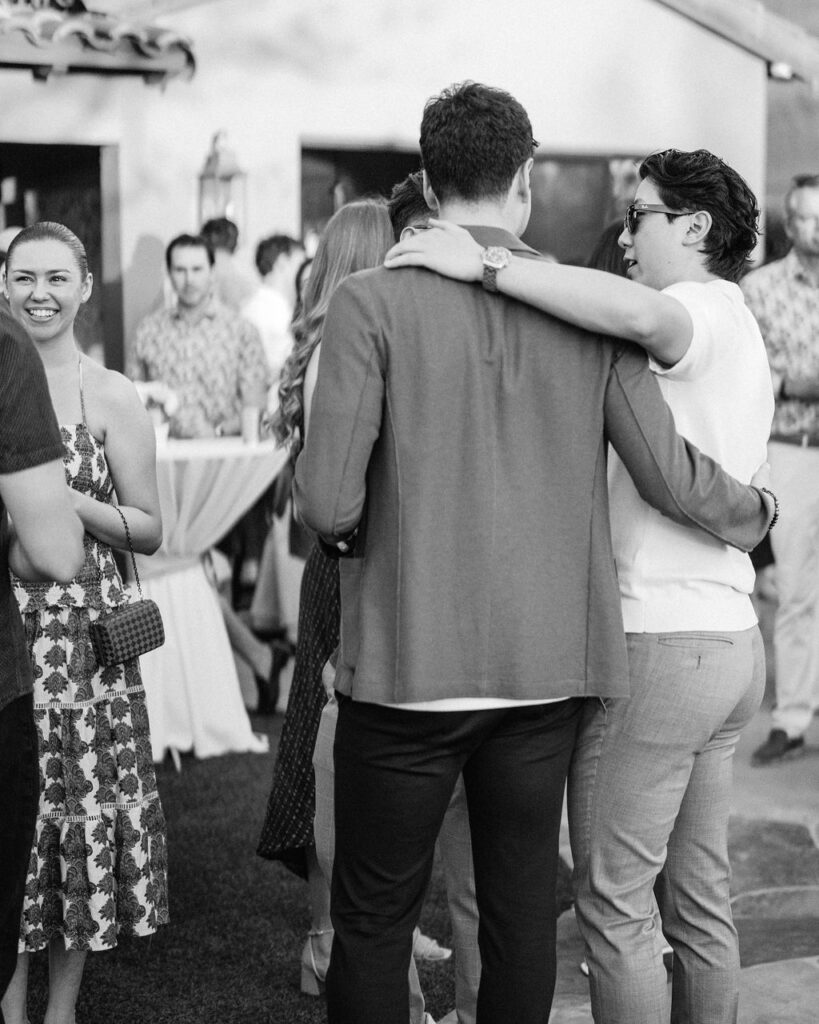 Guests embrace during Silverleaf Masters Golf welcome party in Arizona