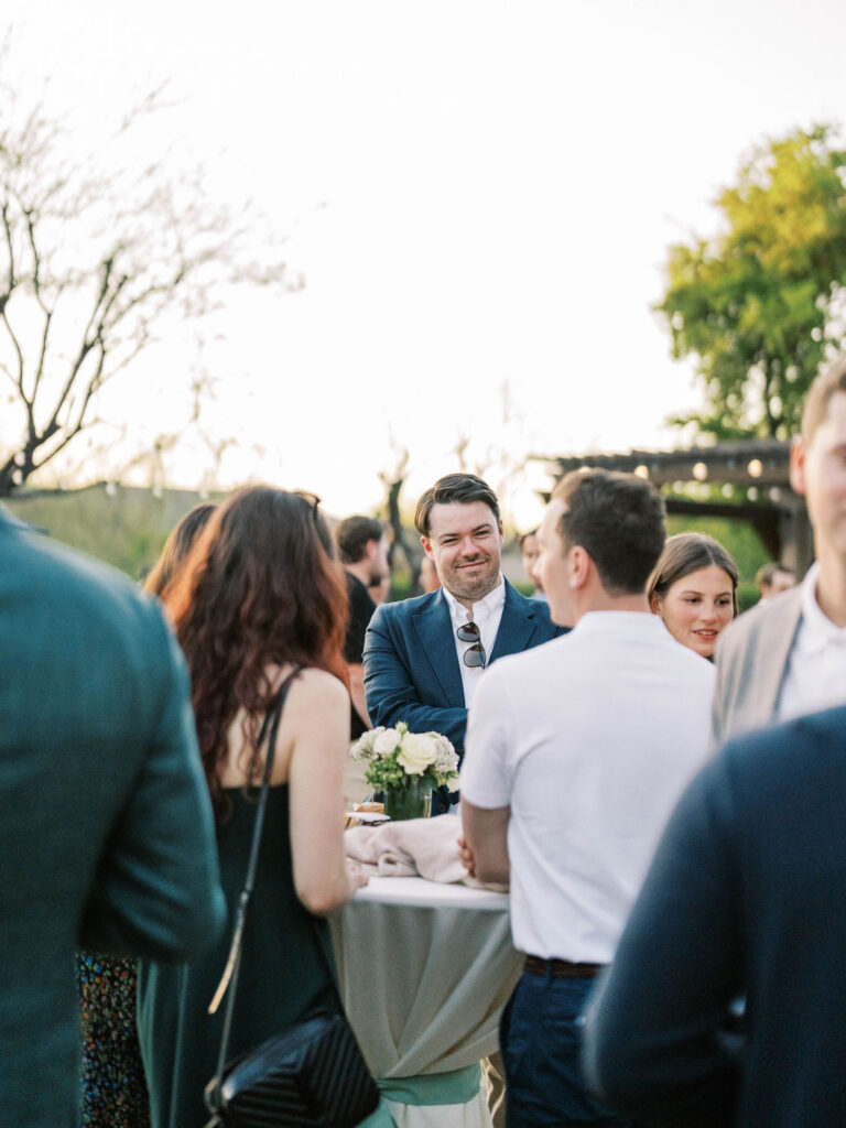 Guests at cocktail table during Silverleaf Masters Golf wedding welcome party