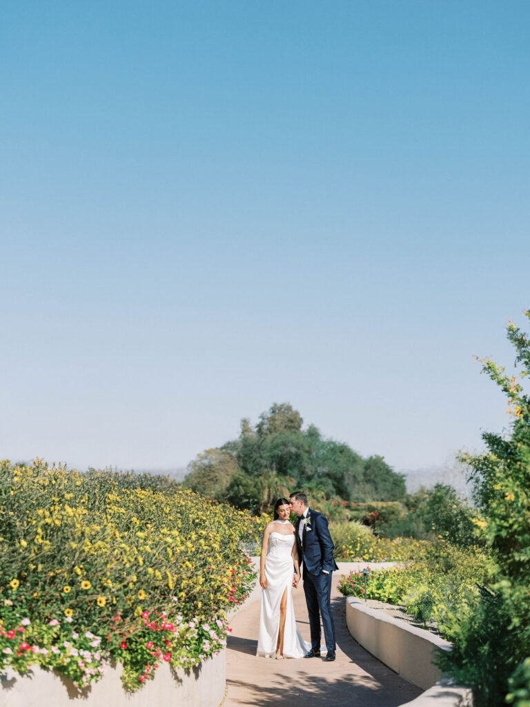 Bride and groom romantic portrait in Camelback Inn gardens