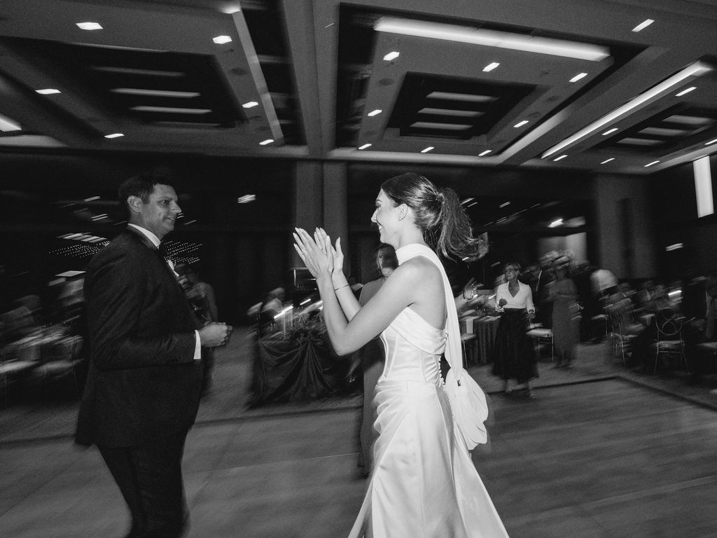 Bride clapping and celebrating at Camelback Inn reception