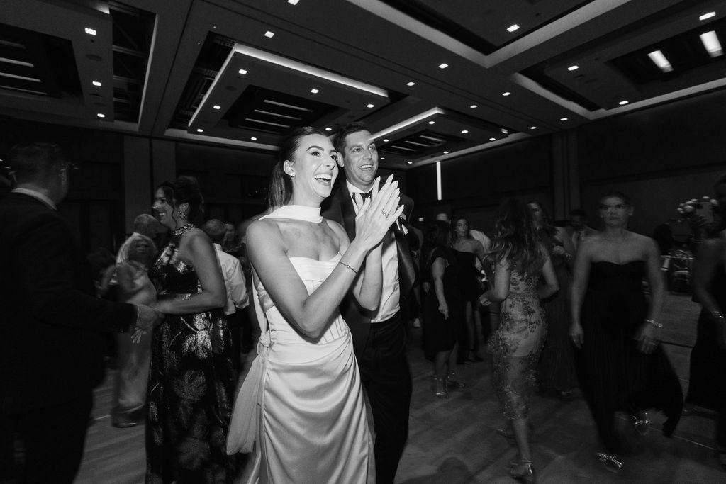 Bride dancing during Camelback Inn wedding reception in black and white