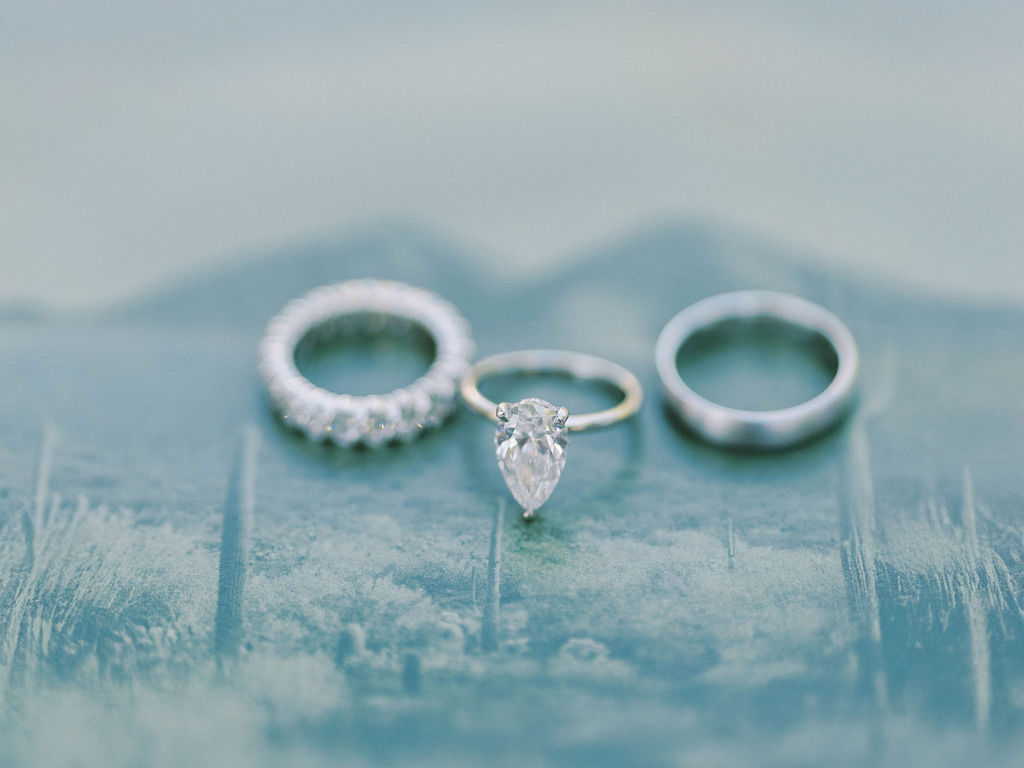 Fine art wedding rings flatlay Camelback Inn wedding