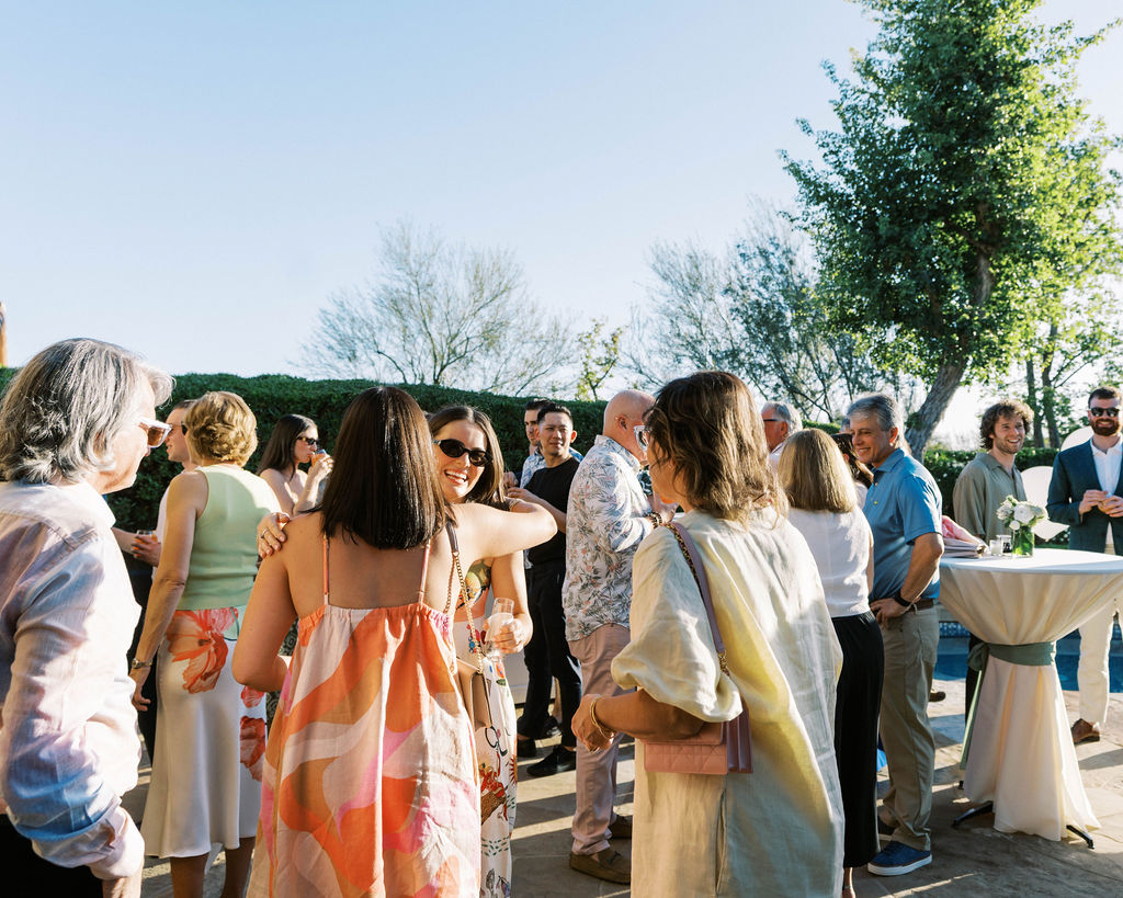 Guests mingling outdoors at Arizona Silverleaf wedding welcome party