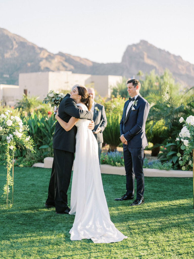 Bride and groom first kiss at Camelback Inn wedding