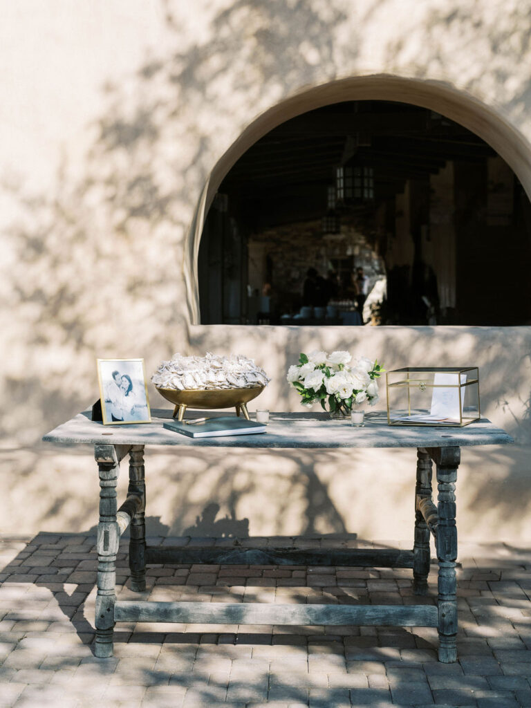 Reception escort card table with florals at DC Ranch wedding