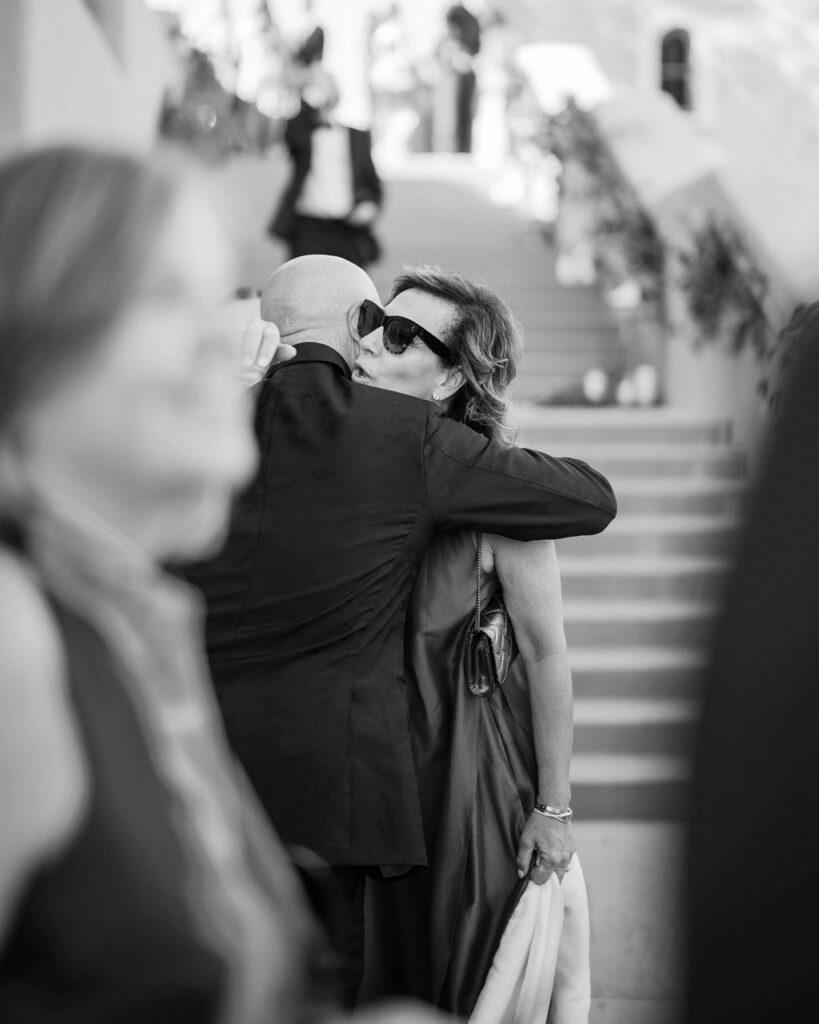 Wedding guest embracing during outdoor reception at DC Ranch