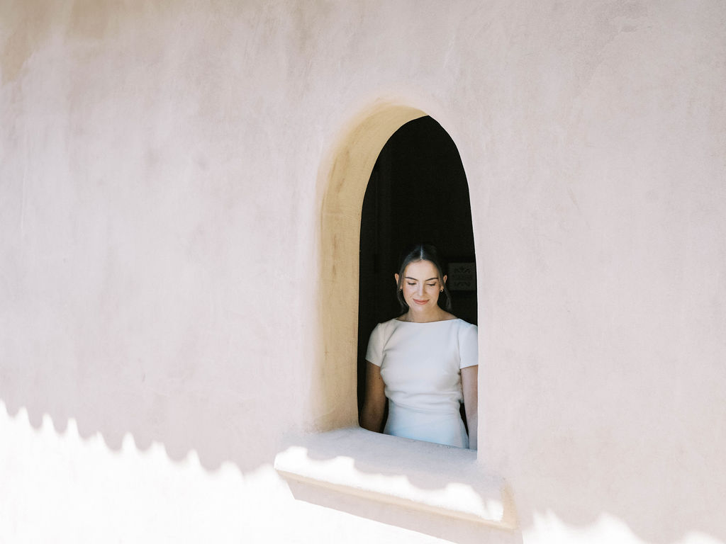 Bride framed in arched window at DC Ranch Scottsdale wedding