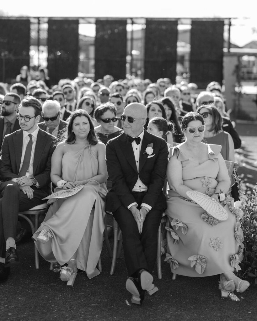 Wedding guests seated during outdoor ceremony at DC Ranch