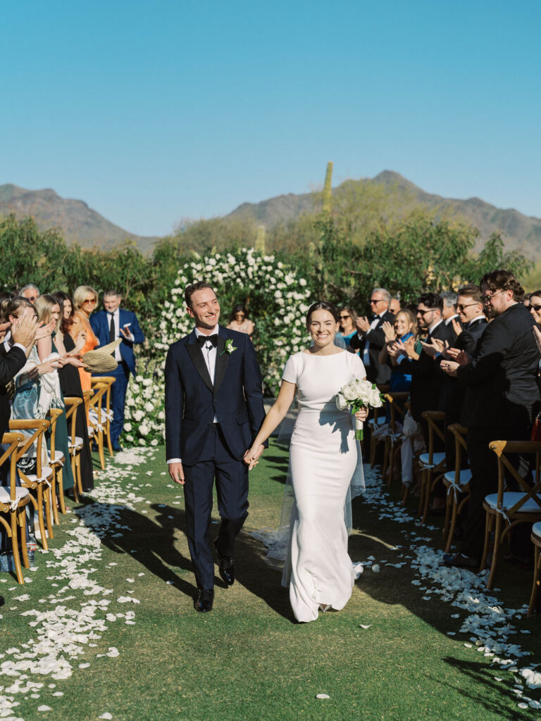 Bride and groom walking down the aisle at DC Ranch wedding