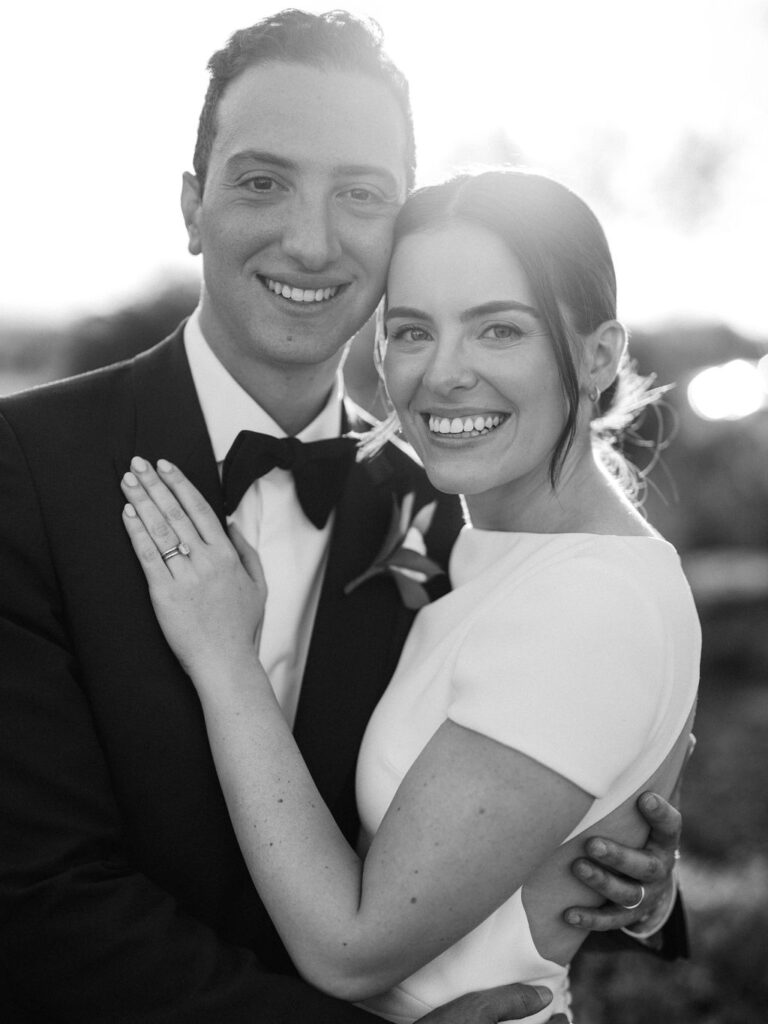 Bride and groom smiling at sunset during DC Ranch wedding