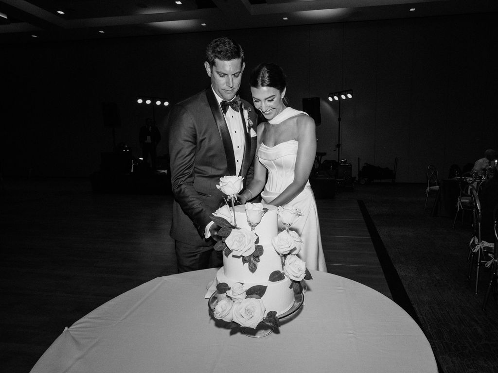 White wedding cake with roses at Camelback Inn reception