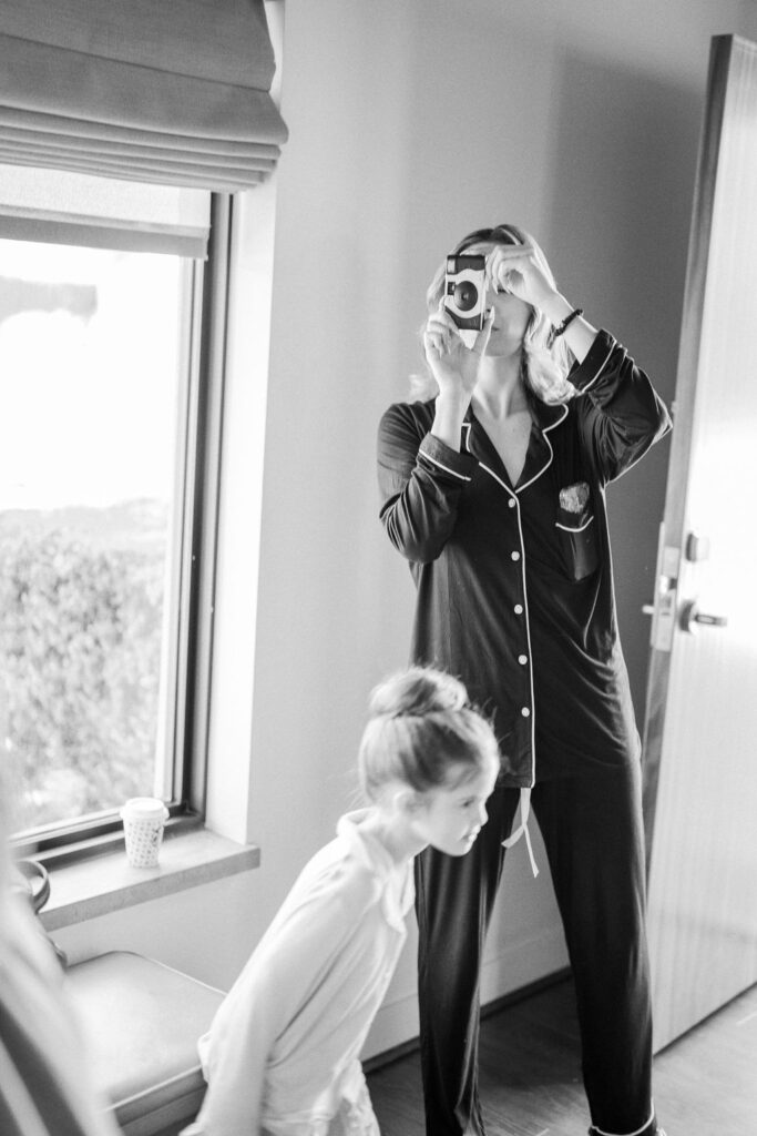 Bride getting ready in black & white documentary photo.