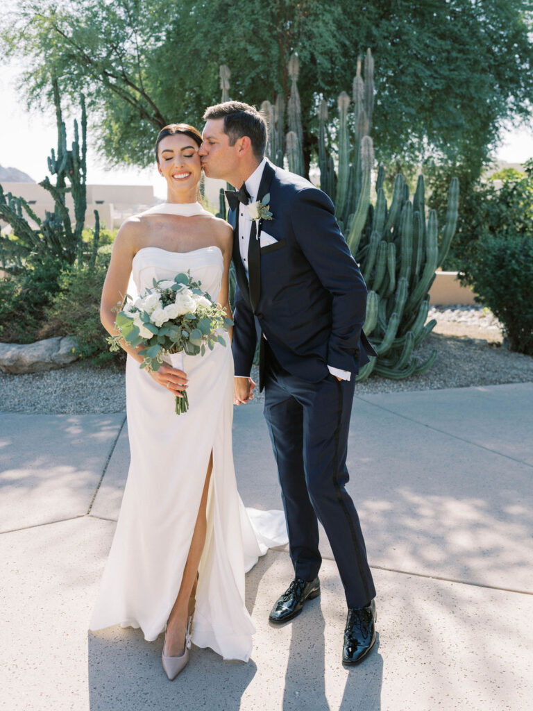 Bride and groom portraits with cactus garden at Camelback Inn